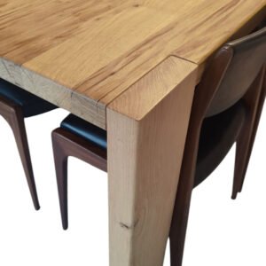 Bespoke solid oak dining table handcrafted for luxury interiors Oaky‑1 solid oak dining table with live edge and natural wood grain, hand‑finished for modern interior use.